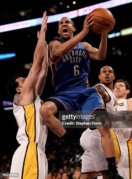 Eric Maynor of the Oklahoma City Thunder goes up for a shot over Jordan Farmar of the Los Angeles Lakers during Game One of the Western Conference...