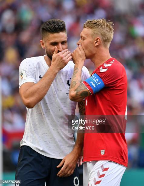 Simon Kjaer of Denmark chats with Olivier Giroud of France during the 2018 FIFA World Cup Russia group C match between Denmark and France at Luzhniki...