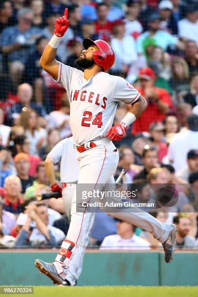 Chris Young of the Los Angeles Angels reacts as he crosses home plate after hitting a solo home run in the third inning of a game against the Boston...