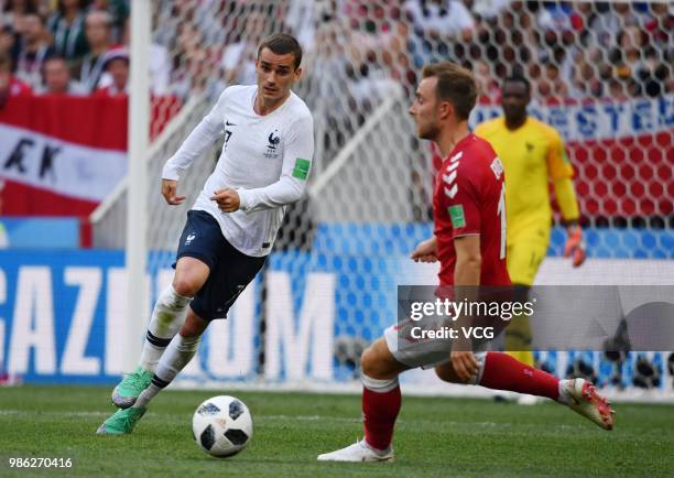 Christian Eriksen of Denmark and Antoine Griezmann of France compete for the ball during the 2018 FIFA World Cup Russia group C match between Denmark...