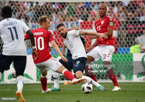 Christian Eriksen of Denmark and Olivier Giroud of France compete for the ball during the 2018 FIFA World Cup Russia group C match between Denmark...