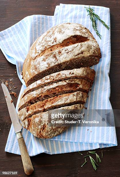 rustic bread with knife - bread knife stock-fotos und bilder