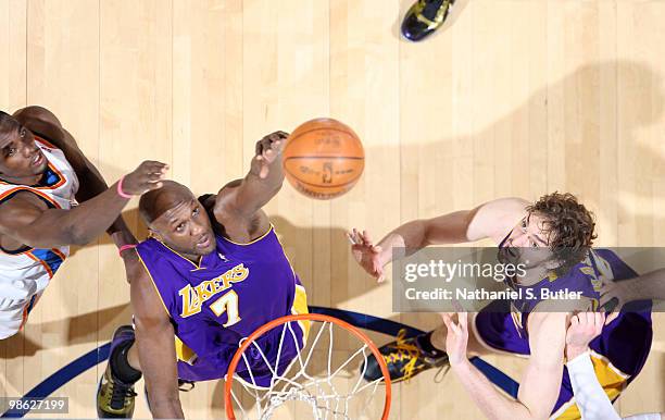 Lamar Odom of the Los Angeles Lakers shoots against Serge Ibaka of the Oklahoma City Thunder while team mate Pau Gasol looks for a rebound in Game...