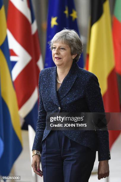 Britain's Prime Minister Theresa May arrives to take part in an European Union leaders' summit focused on migration, Brexit and eurozone reforms on...