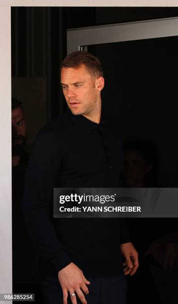 Germany's goalkeeper Manuel Neuer arrives for a press conference at Frankfurt international airport on June 28 after flying back from Moscow...