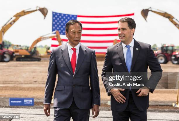 Foxconn CEO Terry Gou and Wisconsin Gov. Scott Walter talk before the groundbreaking of the Foxconn Technology Group computer screen plant on June...