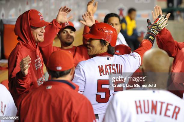 Hideki Matsui of the Los Angeles Angels of Anaheim returns to the dugout after hitting a homerun in the fifth inning against the Detroit Tigers at...