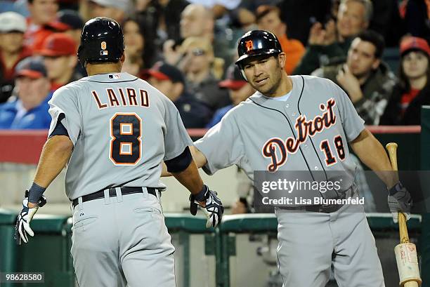 Gerald Laird celebrates with teammate Johnny Damon of the Detroit Tiger after scoring in the second inning against the Los Angeles Angels of Anaheim...