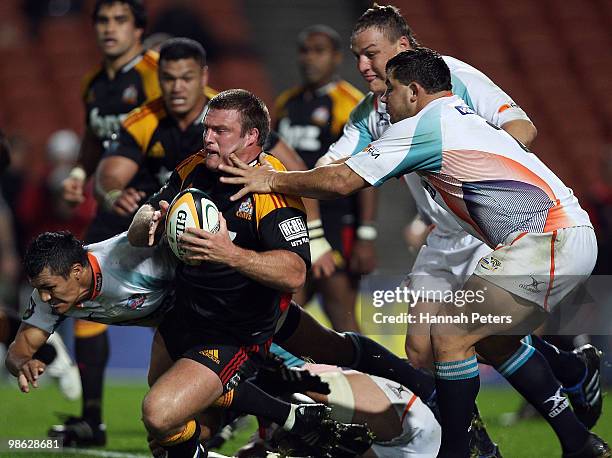 Nathan White of the Chiefs is brought down on attack during the round 11 Super 14 match between the Chiefs and the Cheetahs at Waikato Stadium on...