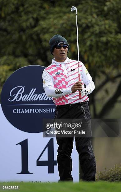 Thongchai Jaidee of Thailand prepares to tees off on the 14th hole during the fog-delayed Round One of the Ballantine's Championship at Pinx Golf...