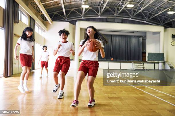 japanese junior high school students enjoying basketball - japan 12 years girl stock pictures, royalty-free photos & images