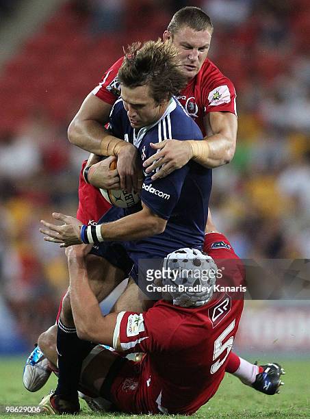 Peter Grant of the Stormers takes on the Reds defence during the round eleven Super 14 match between the Reds and the Stormers at Suncorp Stadium on...