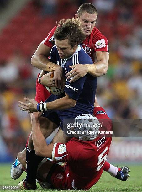 Peter Grant of the Stormers takes on the Reds defence during the round eleven Super 14 match between the Reds and the Stormers at Suncorp Stadium on...