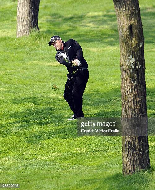 Paul McGinley of Ireland chips into the 2nd green during the Round Two of the Ballantine's Championship at Pinx Golf Club on April 23, 2010 in Jeju...