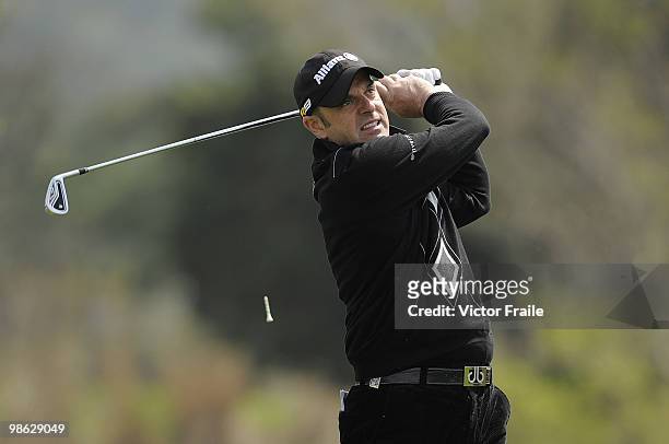 Paul McGinley of Ireland tees off on the 14th hole during the fog-delayed Round One of the Ballantine's Championship at Pinx Golf Club on April 23,...