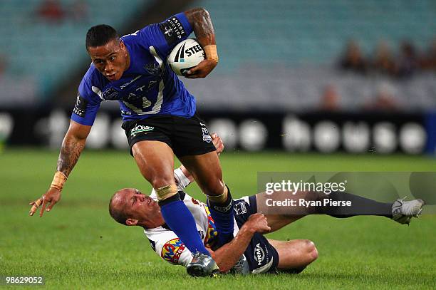 Ben Roberts of the Bulldogs is tackled by Darren Lockyer of the Broncos during the round seven NRL match between the Canterbury Bulldogs and the...