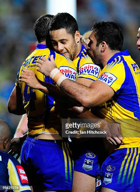 Timana Tahu of the Eels is congratulated by Teammates after scoring a try during the round seven NRL match between the North Queensland Cowboys and...