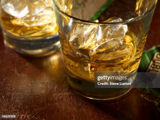 irish whiskey with ice - irish culture stock-fotos und bilder