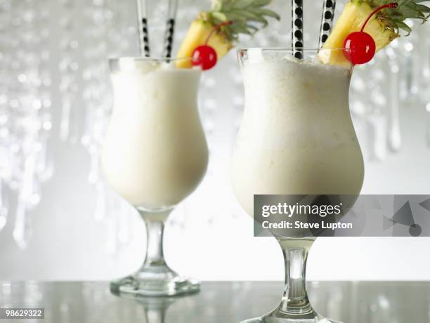 two pina colada cocktail drinks - pina colada stock pictures, royalty-free photos & images