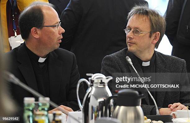 The representatives of the German Bishops' Conference , Trier Bishop Stephan Ackerman and prelate Karl Juesten, chat at the Family Ministry in Berlin...
