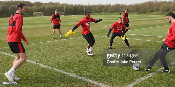 John O'Shea, Michael Carrick, Patrice Evra, Nemanja Vidic, Dimitar Berbatov and Ryan Giggs of Manchester United in action during a First Team...