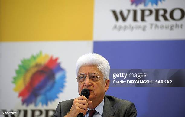 Chairman of Indian software company Wipro, Azim Premji gestures as he announces company financial results at the Wipro campus in Bangalore on April...