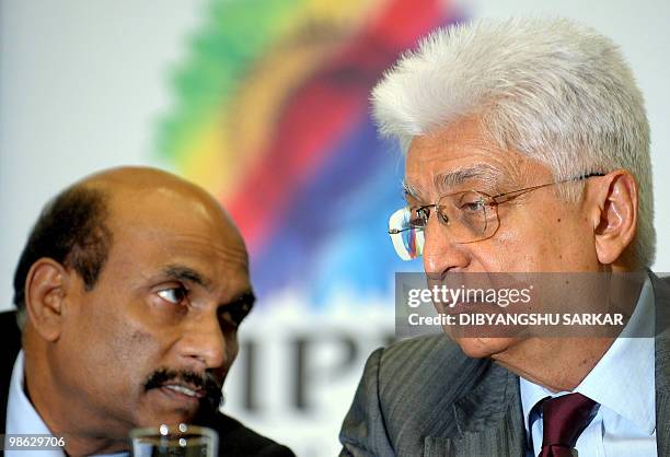 Chairman of Indian software company Wipro, Azim Premji speaks with company Chief Financial Officer Suresh Senapati as he announces company financial...