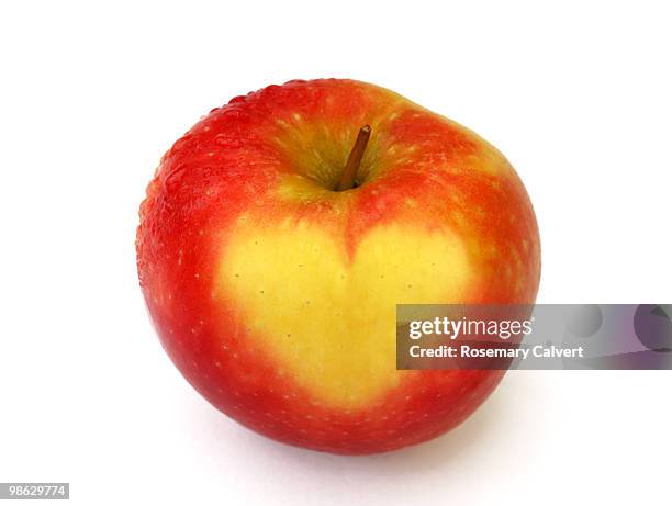 ripe cripps pink apple with heart symbol - apple heart stock pictures, royalty-free photos & images