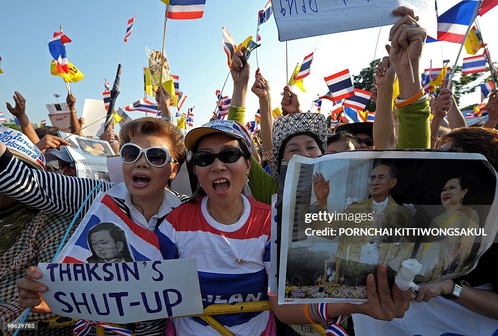 Thai pro-government supporters wave nati