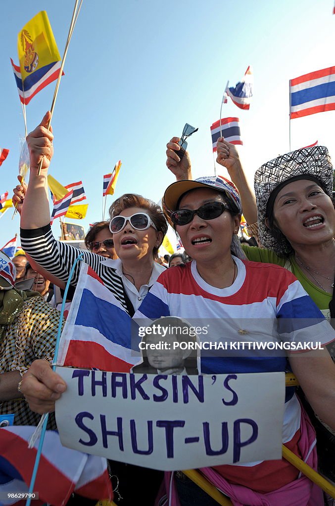 Thai pro-government supporters wave nati