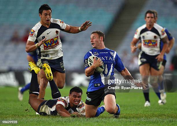 Blake Green of the Bulldogs is tackled by Dunamis Lui of the Broncos during the round seven NRL match between the Canterbury Bulldogs and the...