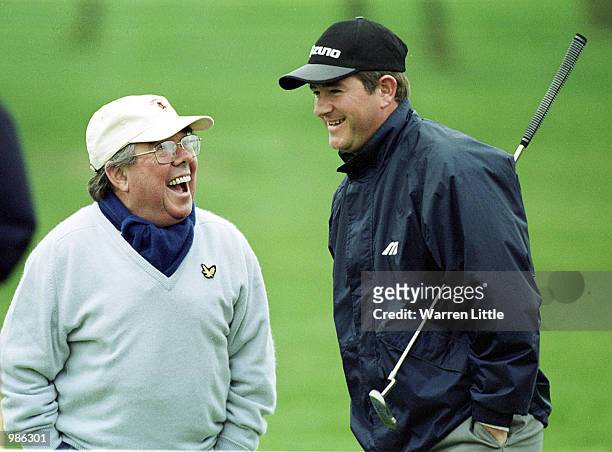 Ronnie Corbett shares a laugh with Peter Baker of England during the Pro-Am event before the Benson & Hedges International Open played at the Belfry,...