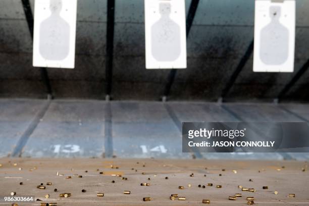 Spent shell casings lie on the ground after school teachers and administrators attending a a three-day firearms course offered by FASTER Colorado...