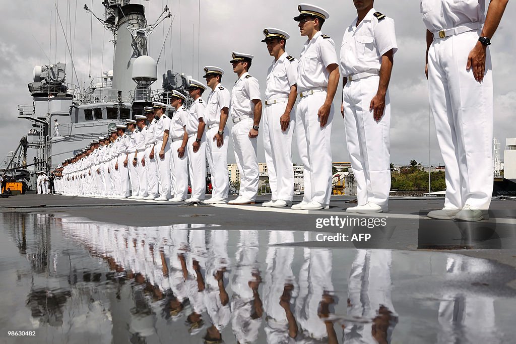 French crew members stand on March 22, 2