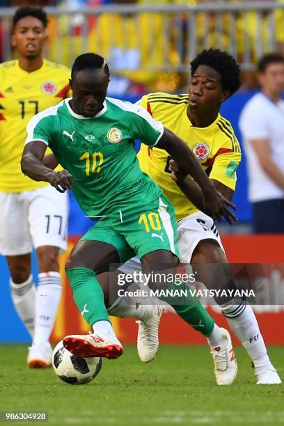 Senegal's forward Sadio Mane vies for the ball with Colombia's midfielder Carlos Sanchez during the Russia 2018 World Cup Group H football match...