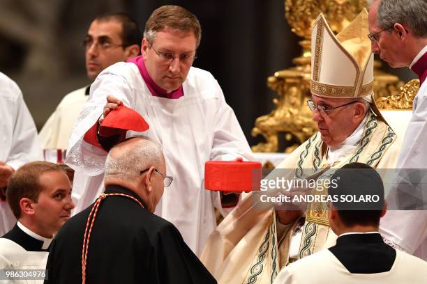 Iraqi Louis Raphael I Sako patriarch of Babylon of the Chaldeans kneels before Pope Francis to pledge allegiance and become cardinal during the...