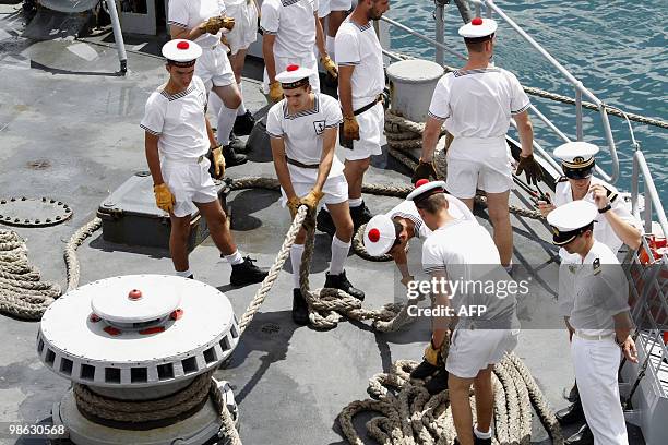 French sailors work on March 22, 2010 on the deck of French helicopter-carrier Jeanne d'Arc, as it leaves Fort-de-France on the French island of La...