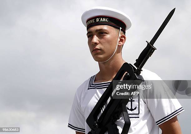 French marine honor guard stands on March 22 on the deck of French helicopter-carrier Jeanne d'Arc, as it leaves Fort-de-France on the French island...