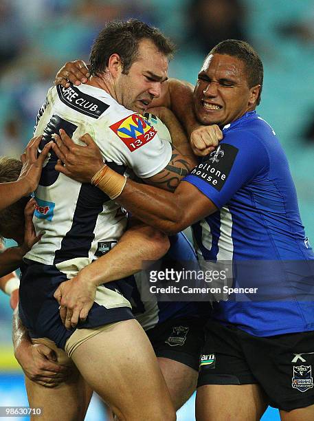 Scott Anderson of the Broncos is tackled by Yileen Gordon of the Bulldogs during the round seven NRL match between the Canterbury Bulldogs and the...