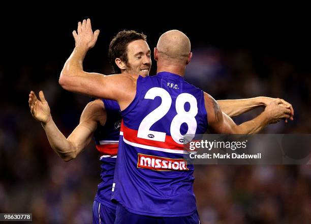 Robert Murphy and Barry Hall of the Bulldogs celebrate a goal during the round five AFL match between the Western Bulldogs and the Adelaide Crows at...