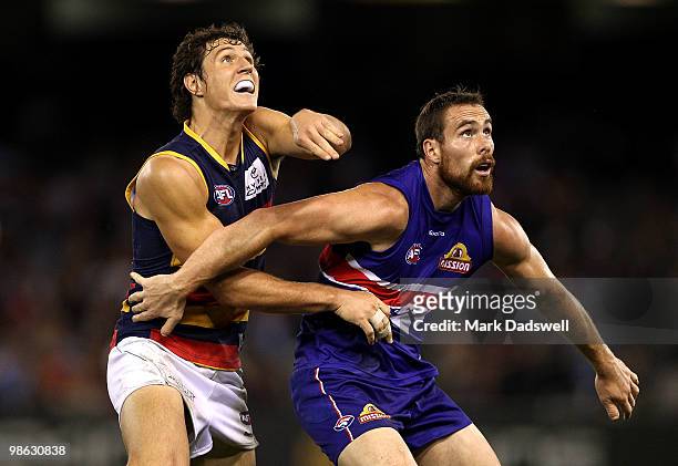 Kurt Tippett of the Crows contests a boundary throw in with Ben Hudson of the Bulldogs during the round five AFL match between the Western Bulldogs...