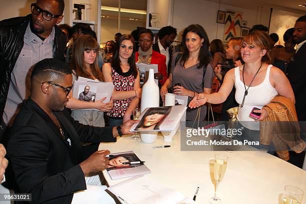 Kieth Campbell signs books during the "Cuts Of Our Infirmities" book launch party at the Tracy Reese Boutique on April 22, 2010 in New York City.