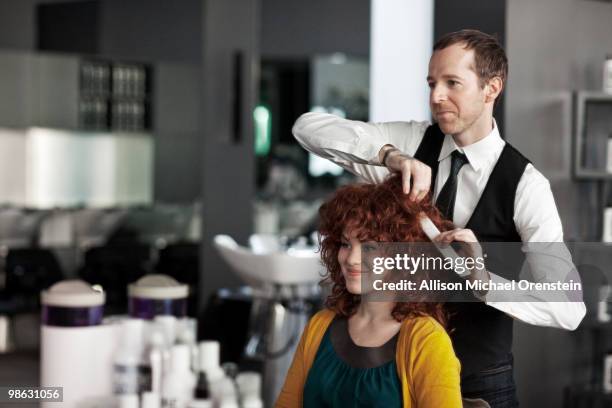 woman getting hair consultation - hairdresser foto e immagini stock