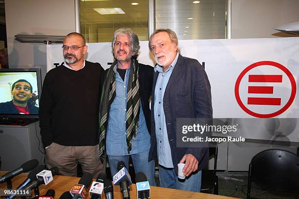 Medical workers Matteo Dell'Aira and Marco Garatti pose for photographs with Gino Strada, founder of Italian aid agency Emergency, at the agency's...