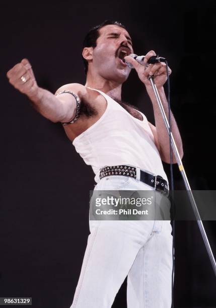 Freddie Mercury of Queen performs on stage at Live Aid at Wembley Stadium on 13th July 1985 in London.