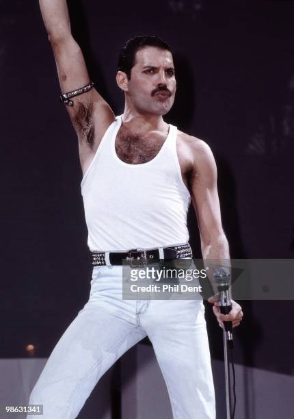 Freddie Mercury of Queen performs on stage at Live Aid at Wembley Stadium on 13th July 1985 in London.