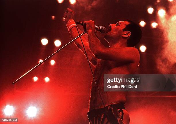 Freddie Mercury of Queen performs on stage at Wembley Arena on 4th September 1984 in London.