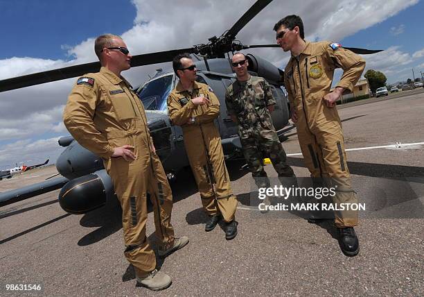 French Air Force observors Lt Delbart, Lt Fabrice Albrecht, Commando F. Romaire and Pilot Olivier Mainy stand in front of a HH-60 Pave Hawk...