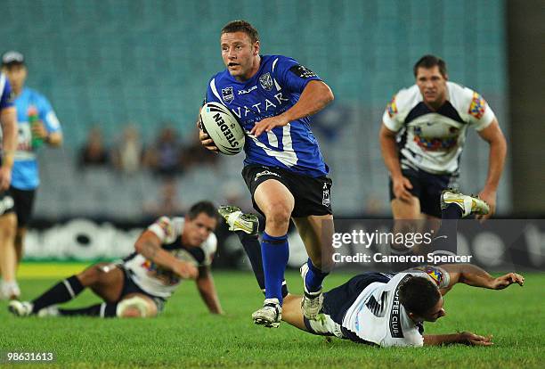 Blake Green of the Bulldogs makes a break during the round seven NRL match between the Canterbury Bulldogs and the Brisbane Broncos at ANZ Stadium on...