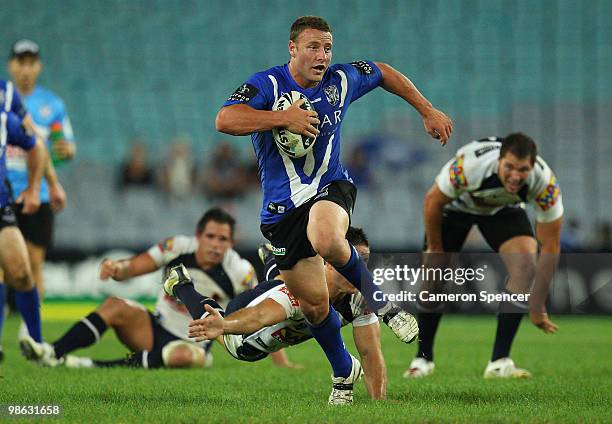 Blake Green of the Bulldogs makes a break during the round seven NRL match between the Canterbury Bulldogs and the Brisbane Broncos at ANZ Stadium on...